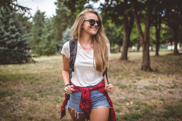 istock Beautiful hiker girl hiking through a forest alone 1026683538