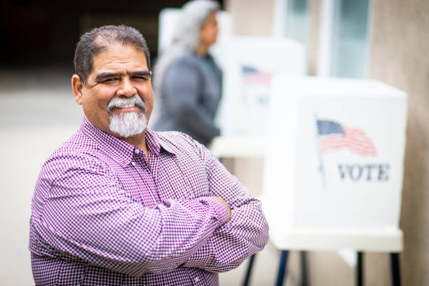 istock Senior Mexican Man Voting 1026684406