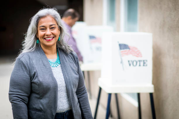 istock Senior Mexican Woman Voting 1026684618