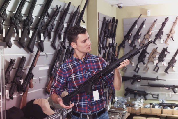 istock Man buying air weapon 1026689544