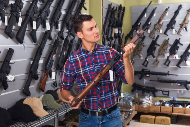 istock Man buying air weapon 1026689570