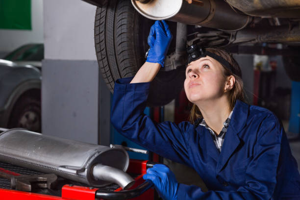 istock Female master is repairing car on her workplace 1026689716