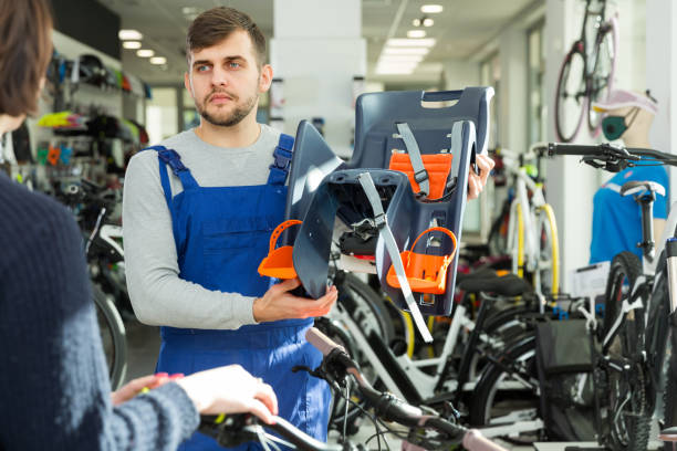 istock Young man demonstrating bicycle sit for child 1026690356
