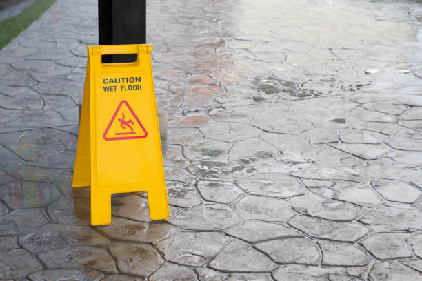 istock wet floor warning sign on floor 1026712944