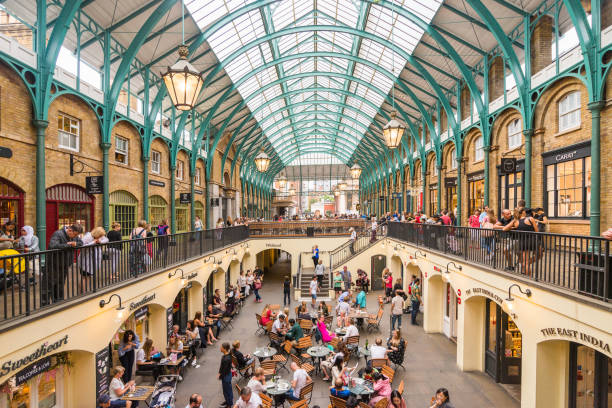 Summer in Covent garden, one of the biggest flea market in UK LONDON, UK - July 20, 2018: Summer in Covent garden, one of the biggest flea market in UK covent garden photos stock pictures, royalty-free photos & images