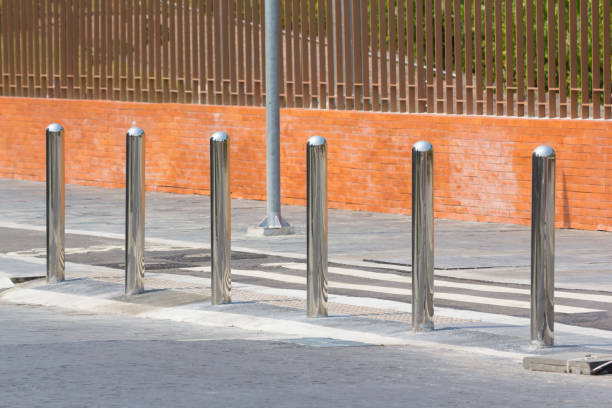 istock stainless steel bollards on footpath 1026719244