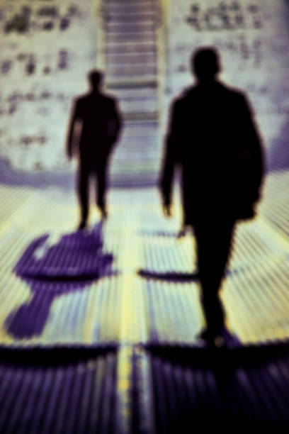 Taken this blurred picture of a man in dark followed by anther person. It is seldom prevalent that we do not realize that we are followed by someone and do not realize it.
