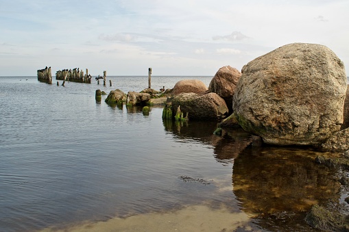 A view of old breakwater posts on beach,Lapmezciems, Riga Bay, Latvia