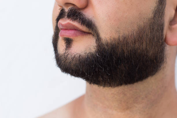 istock Close-up of a man beard and mustache over white background. 1026743942