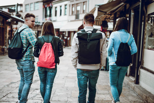 istock Group Of Friends Taking A Walk Through The Old Bazaar 1026746552