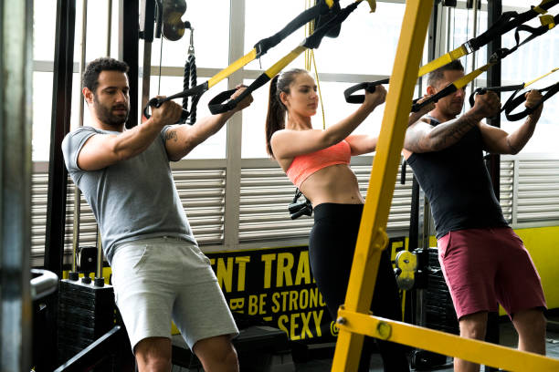 istock Friends doing weight exercises in the gym 1026747890