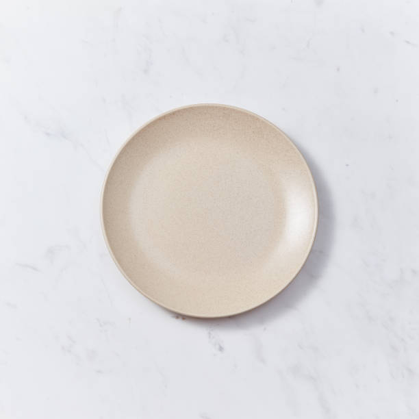 The handmade ceramic dish on a gray marble table. Traditional ceramic handcrafted. Flat lay