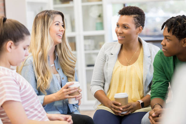 istock Mothers attend support group with their teenagers 1026754442
