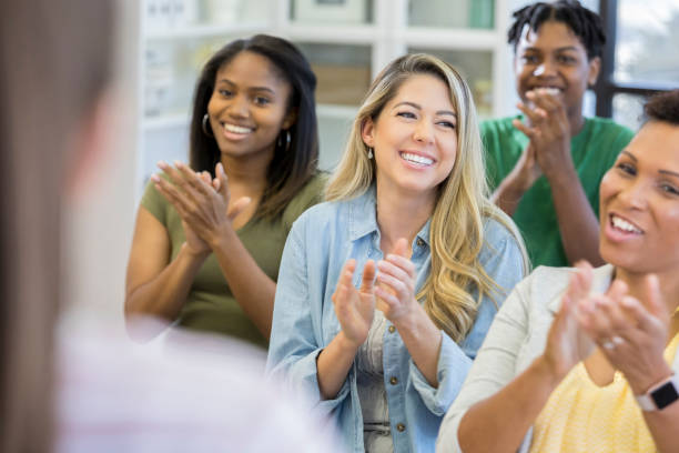 istock Cheerful group of people applauding 1026754476