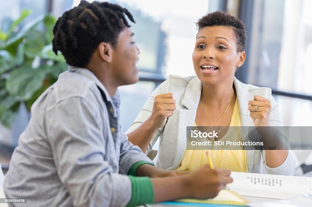 Mom Helps Son Frustrated Mom Helps Son With Homework Stock Photo - Download Image Now - Teenager, Teacher, Assistance - iStock