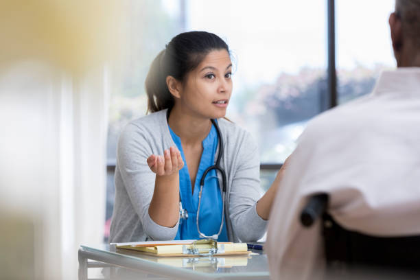 istock Doctor has serious discussion with senior patient 1026754660