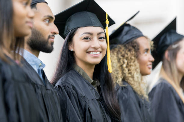 istock Confident female Hispanic college graduate 1026754784