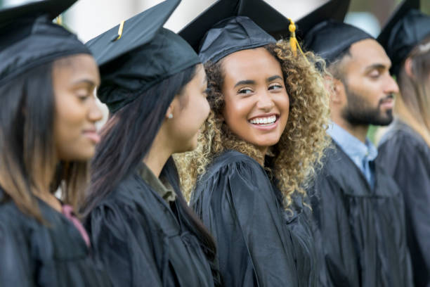 istock Smiling group of college grads 1026754794