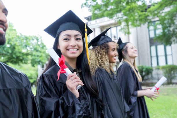 istock Proud graduate holds diploma 1026754826