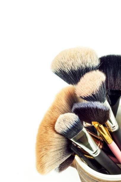 istock Makeup brushes in a ceramic mug on a white background. Cosmetic industry. Brush for beauty. Beautiful women. Detailed view. 1026765920