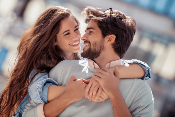 istock Happy young couple having fun outdoors 1026766244