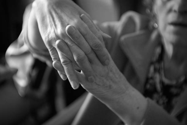 istock Hands of elderly woman with alzheimer doing massage 1026770292