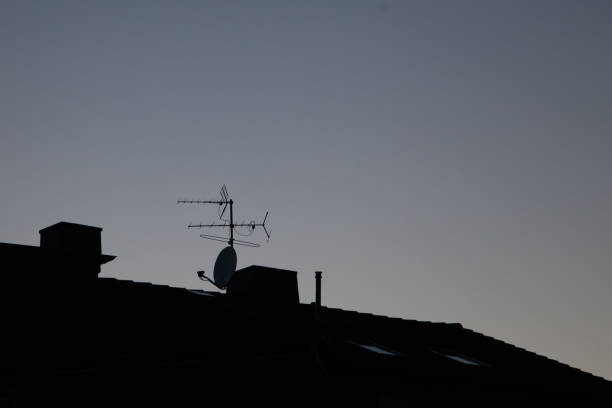 istock old TV antenna and satellite dish on the roof 1026774050