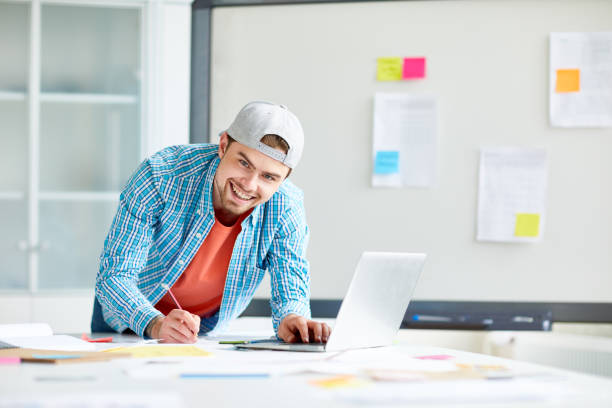 istock Cheerful marketing specialist at work 1026774382