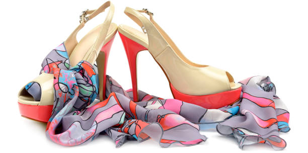 istock Elegant sandals and scarf isolated on white background 1026777364