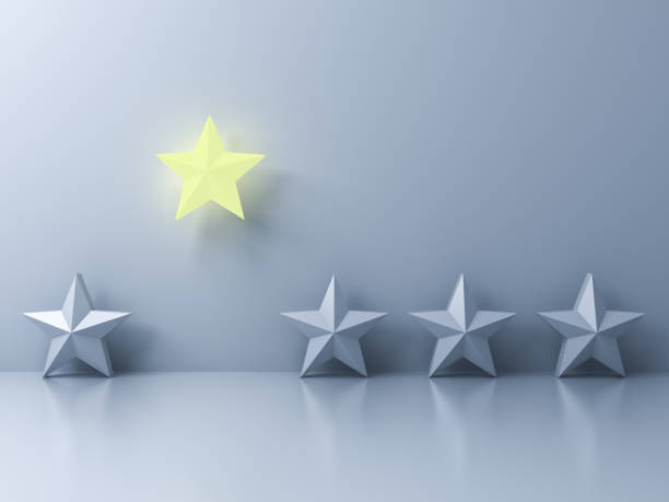 istock Stand out from the crowd and different creative idea concepts One glowing yellow star shining with other dim stars on white wall background with reflections and shadows 3D rendering 1026783260