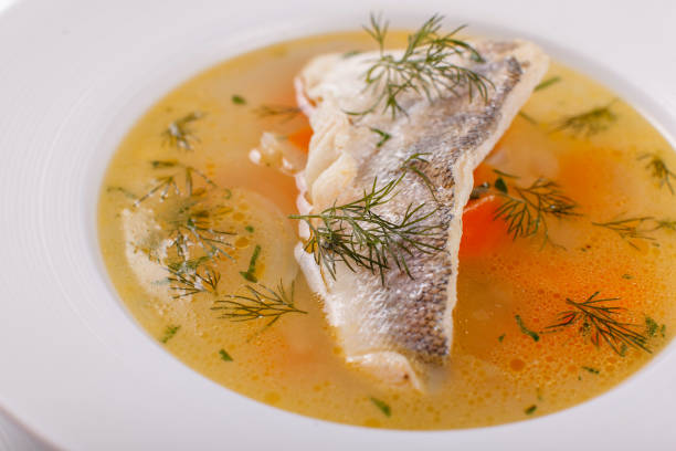 istock Fish and seafood soup . Delicious soup with white fish and vegetables for dinner 1026783330
