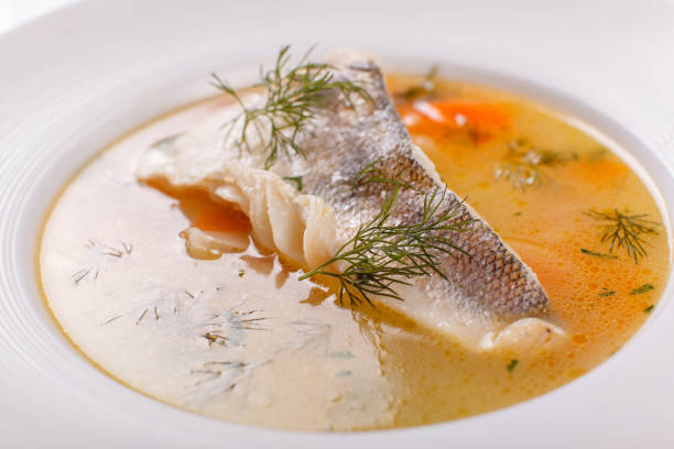 istock Fish and seafood soup . Delicious soup with white fish and vegetables for dinner 1026783362