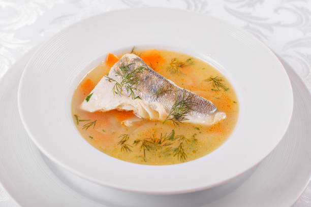 istock Fish and seafood soup . Delicious soup with white fish and vegetables for dinner 1026783374