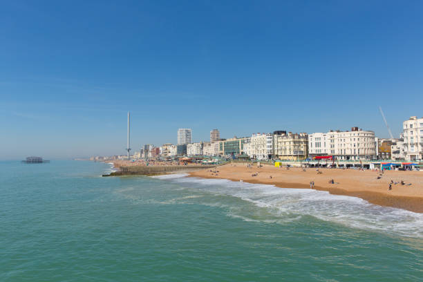 Brighton seafront England in beautiful weather Brighton beach busy with visitors and tourists in beautiful spring weather in East Sussex UK eastbourne pier photos stock pictures, royalty-free photos & images