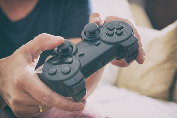 istock Woman plays video game using the gamepad 1026787732