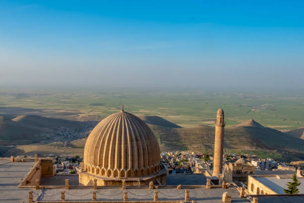 Minaret of the Great Mosque known also as Ulu Cami with mesopotamian plain in the background, Mardin, Turkey. Minaret of the Great Mosque known also as Ulu Cami with mesopotamian plain in the background, Mardin, Turkey. ulu camii stock pictures, royalty-free photos & images