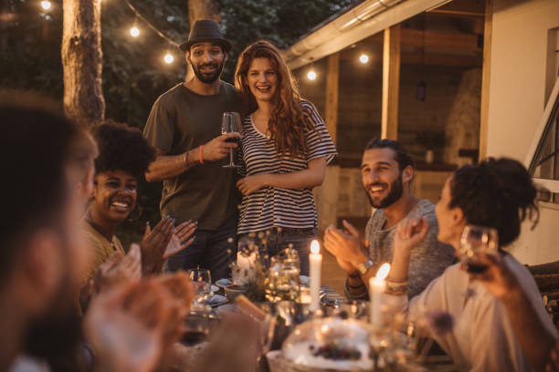 istock Friends have dinner on porch 1026791728