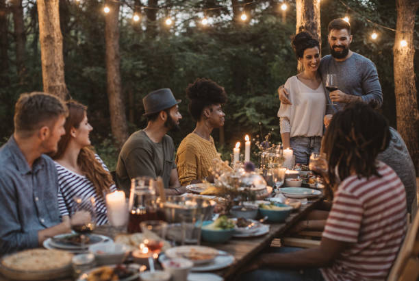 istock Friends have dinner on porch 1026791802