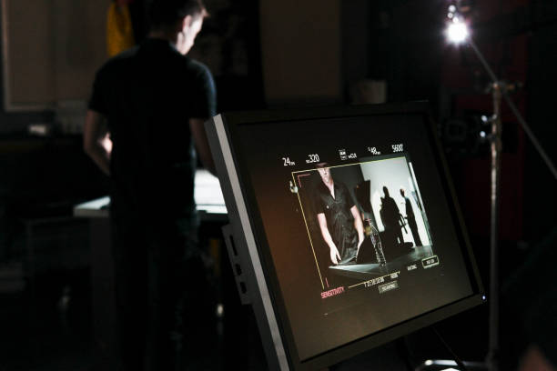 istock People Working Behind the Scenes while Filming on a Film Set 1026791828