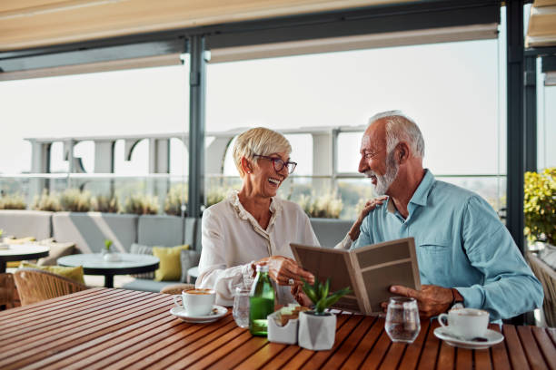 istock Senior Couple In Restaurant Ordering Food 1026796872