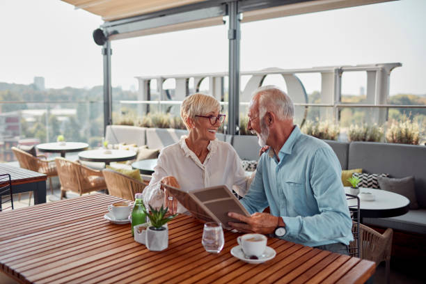 istock Senior Couple In Restaurant Ordering Food 1026797028