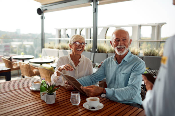 istock Senior Couple In Restaurant Ordering Food 1026797116