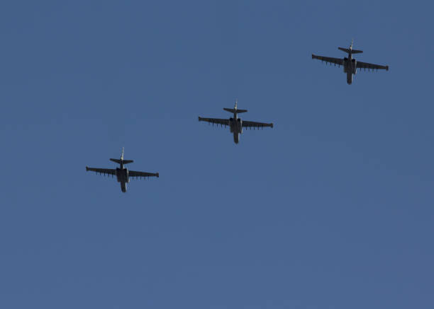 istock Several military fighters are flying in a formation against the blue sky 1026799366