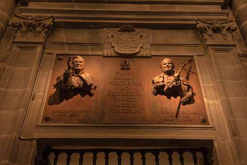 Santiago de Compostela, Spain, 14 June 2018: A plaque commemorating the stay of Pope Benedict XVI and John Paul II at the tomb of Saint James in the Cathedral of St. Jacob in Santiago de Compostella in Spain