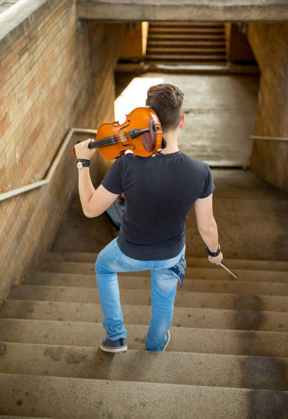 istock Street musician playing violin 1026811668