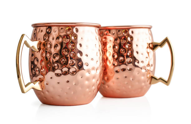 Moscow mule cocktail copper mugs Moscow mule cocktail copper mugs isolated on white background mule stock pictures, royalty-free photos & images
