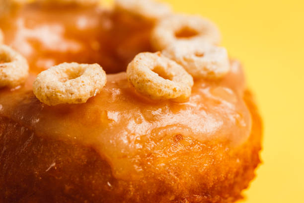 istock Donut with honey glaze on a yellow background 1026820764
