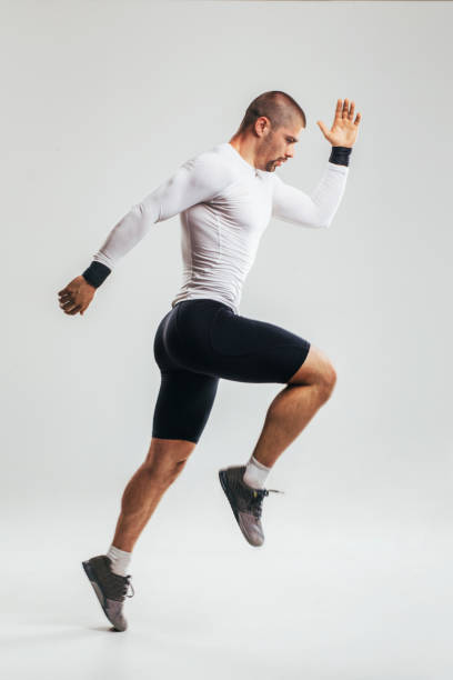 istock Fit and muscular man jumping 1026821012