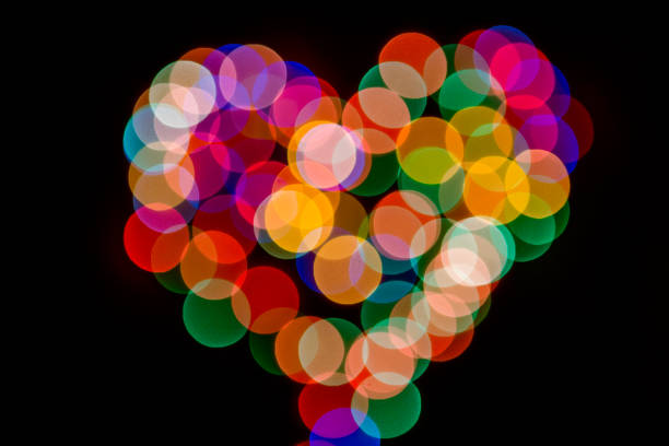 istock Abstract background with heart shape bokeh defocused lights and shadow 1026823116