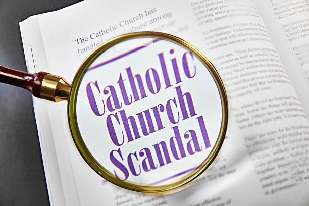 Catholic Church Scandal Catholic Church Scandal on magazine with magnifying glass+++ I wrote all the text +++ clergy stock pictures, royalty-free photos & images